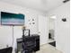 Bedroom featuring a wall-mounted TV, desk and chair, and a doorway leading to another room at 3854 Feather Dr, Lakeland, FL 33812