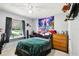 Comfortable bedroom featuring natural light and unique decor at 3854 Feather Dr, Lakeland, FL 33812
