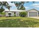 Well-kept home exterior featuring a manicured lawn and tasteful landscaping at 3854 Feather Dr, Lakeland, FL 33812