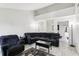 Comfortable living room featuring a sectional sofa, wood-look floors, and bright lighting at 3854 Feather Dr, Lakeland, FL 33812