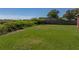 Expansive backyard with lush green grass and a wood fence at 4230 Viola Rd, Lakeland, FL 33810