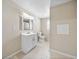 Traditional bathroom featuring a vanity with storage, toilet, and a tiled shower at 4230 Viola Rd, Lakeland, FL 33810