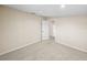 Bedroom featuring carpeted floors, neutral paint, and a door leading to another room at 4230 Viola Rd, Lakeland, FL 33810