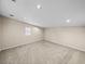 Bedroom featuring carpeted floors, neutral paint, and a window at 4230 Viola Rd, Lakeland, FL 33810