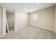 Bedroom with carpet, neutral walls, closet, and a window at 4230 Viola Rd, Lakeland, FL 33810