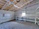 Bright garage interior features shelving, storage and natural light at 4230 Viola Rd, Lakeland, FL 33810