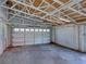 Wide shot of the interior of a metal garage with the white garage door panels in view at 4230 Viola Rd, Lakeland, FL 33810
