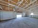 Interior of a metal garage with white framing and concrete floor at 4230 Viola Rd, Lakeland, FL 33810