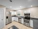 Well-lit kitchen with stainless steel appliances and stylish countertops at 4230 Viola Rd, Lakeland, FL 33810
