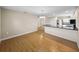 Open living area with wood floors seamlessly connected to the kitchen space at 4230 Viola Rd, Lakeland, FL 33810