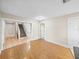 Bright living room with wood floors and an entryway to the stairway at 4230 Viola Rd, Lakeland, FL 33810