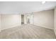Open living room with neutral carpet, ample natural light, and doorways to other rooms at 4230 Viola Rd, Lakeland, FL 33810