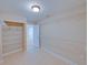 Spacious walk-in closet with tile flooring, built-in shelving, and ample storage space at 4230 Viola Rd, Lakeland, FL 33810