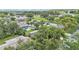 Neighborhood aerial view featuring mature trees and a home with screened pool at 4622 Grovecrest Dr, Lakeland, FL 33813