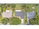 Aerial view of home featuring a dark gray roof, well-maintained landscaping, and backyard at 4622 Grovecrest Dr, Lakeland, FL 33813