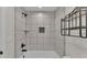 Bright bathroom with white tiled shower and modern bronze fixtures at 4622 Grovecrest Dr, Lakeland, FL 33813