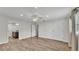 Spacious bedroom with wooden floors, ceiling fan, closet, and ensuite bathroom at 4622 Grovecrest Dr, Lakeland, FL 33813