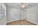 Empty bedroom features wooden floors, closet and ceiling fan at 4622 Grovecrest Dr, Lakeland, FL 33813