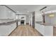 Well-appointed kitchen with granite countertops, stainless steel appliances, white cabinetry, and an open layout at 4622 Grovecrest Dr, Lakeland, FL 33813