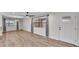 Bright living room featuring hardwood floors, natural light, and neutral walls at 4622 Grovecrest Dr, Lakeland, FL 33813