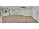 Open living room with wood-look tile flooring and natural lighting at 4622 Grovecrest Dr, Lakeland, FL 33813