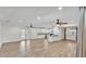 Open concept living room showcasing wood-look floors and lots of natural light at 4622 Grovecrest Dr, Lakeland, FL 33813