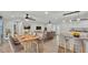 Open-concept living space with modern furniture, wood-look tile, and ample natural light at 4622 Grovecrest Dr, Lakeland, FL 33813