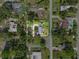Aerial view showcasing the property's location within a residential neighborhood surrounded by lush greenery at 504 Prado Pl, Lakeland, FL 33803