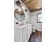 Updated bathroom with a vessel sink, marble counters, wood ceiling and modern fixtures at 504 Prado Pl, Lakeland, FL 33803