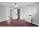 Bright bedroom featuring wood flooring and white paneled doors offering views to other rooms at 504 Prado Pl, Lakeland, FL 33803