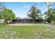Spacious ranch style home with a big yard, screened in porch, and mature trees at 504 Prado Pl, Lakeland, FL 33803