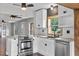 Beautiful kitchen with modern white cabinets, stainless steel appliances, and eat-in island at 504 Prado Pl, Lakeland, FL 33803