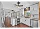 Beautiful kitchen with modern white cabinets, stainless steel appliances, and eat-in island at 504 Prado Pl, Lakeland, FL 33803