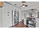 Spacious eat-in kitchen boasts stainless steel refrigerator and appliances with wood-look flooring at 504 Prado Pl, Lakeland, FL 33803
