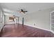 Open-concept living room with beautiful hardwood floors and abundant natural light at 504 Prado Pl, Lakeland, FL 33803