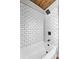 Modern bathroom shower featuring white subway tile with black accents and sleek fixtures at 504 Prado Pl, Lakeland, FL 33803