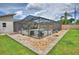 The backyard with enclosed pool and patio offers a private and inviting space for relaxation and entertainment at 5313 Nichols W Dr, Lakeland, FL 33812
