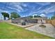 The expansive backyard features a fire pit and screened pool area, ideal for outdoor living and entertaining at 5313 Nichols W Dr, Lakeland, FL 33812