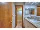 Bathroom featuring a granite-topped vanity and access to shower and tub at 5313 Nichols W Dr, Lakeland, FL 33812