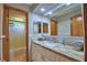 Bathroom featuring a granite-topped vanity and access to shower and tub at 5313 Nichols W Dr, Lakeland, FL 33812