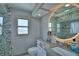 Bathroom featuring a vanity with beautiful countertop and designer tile accents at 5313 Nichols W Dr, Lakeland, FL 33812