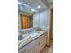 Bright bathroom featuring granite countertops, neutral walls, and an open doorway to an adjacent room at 5313 Nichols W Dr, Lakeland, FL 33812