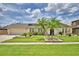 Charming single-story home featuring lush landscaping, a well-manicured lawn, and beautiful curb appeal at 5313 Nichols W Dr, Lakeland, FL 33812