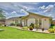Well-maintained home exterior with mature landscaping, a green lawn, and a welcoming facade at 5313 Nichols W Dr, Lakeland, FL 33812