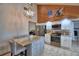 Spacious kitchen featuring granite countertops, stainless steel appliances, and a breakfast bar at 5313 Nichols W Dr, Lakeland, FL 33812