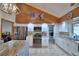 Bright, updated kitchen featuring stainless steel appliances, granite countertops, and white cabinetry at 5313 Nichols W Dr, Lakeland, FL 33812