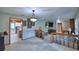 Split-level living room, with a view of the kitchen and downstairs Gathering room with fireplace at 5313 Nichols W Dr, Lakeland, FL 33812