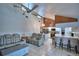 Bright living room with a ceiling fan, comfortable seating, tile floors, and an open layout to the kitchen at 5313 Nichols W Dr, Lakeland, FL 33812