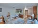Comfortable living room with TV, sofa and view of entryway and steps to another room at 5313 Nichols W Dr, Lakeland, FL 33812