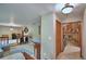 Open living room with stairway, hardwood floors, and view of Gathering room with fireplace at 5313 Nichols W Dr, Lakeland, FL 33812